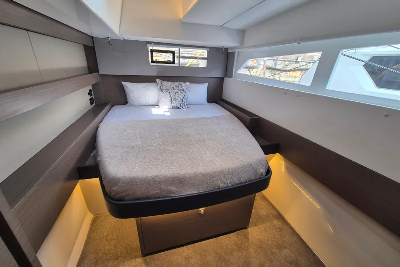 Tafika Yacht Photos Pics Luxurious cabin interior of 2024 Leopard 50 yacht with modern design and cozy bedding.