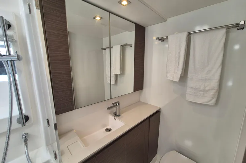 Tafika Yacht Photos Pics Modern bathroom in 2024 Leopard 50 yacht, featuring sleek design and elegant fixtures.