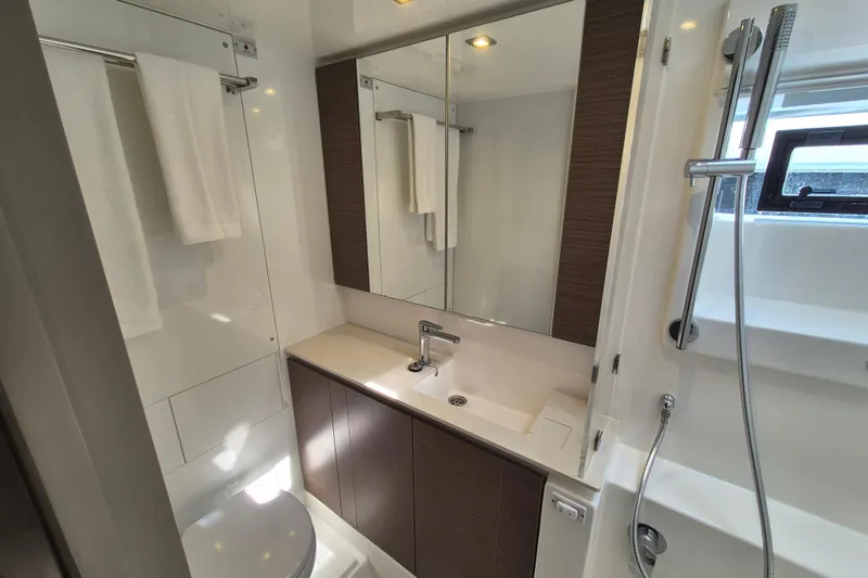 Tafika Yacht Photos Pics Modern bathroom in 2024 Leopard 50 yacht with sleek fixtures and ample lighting.