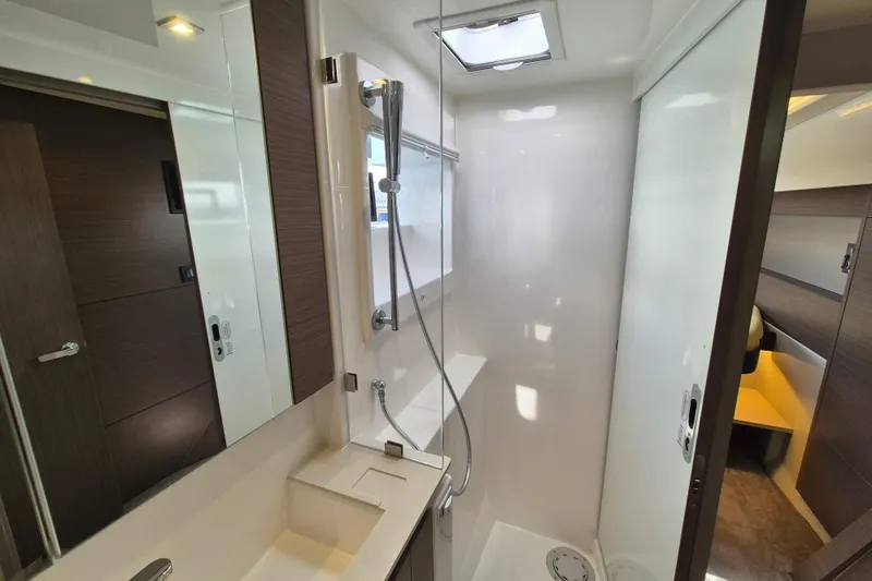 Tafika Yacht Photos Pics Modern bathroom interior in 2024 Leopard 50 yacht, featuring sleek shower and elegant design.