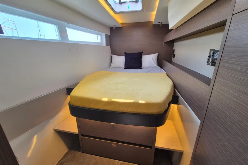 Tafika Yacht Photos Pics Luxurious cabin interior of 2024 Leopard 50 yacht with cozy bed and modern design.