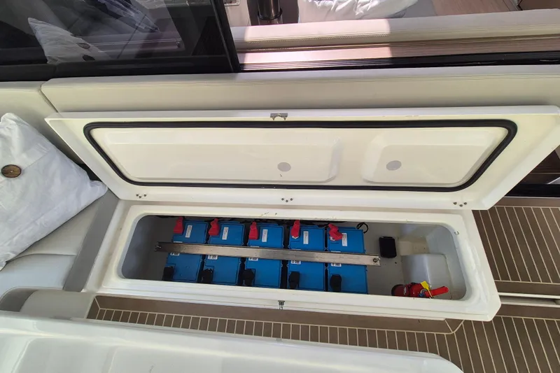 Tafika Yacht Photos Pics Battery compartment of 2024 Leopard 50 yacht, showcasing blue batteries and organized storage.