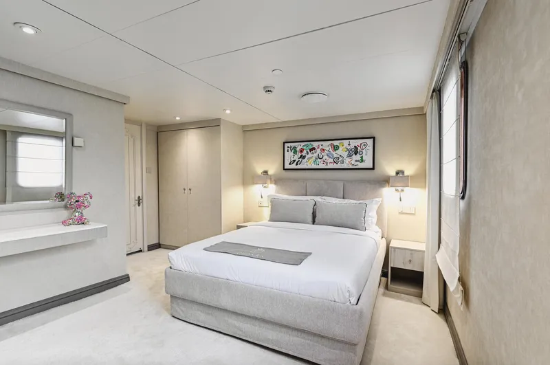 Chakra Yacht Photos Pics Luxurious bedroom interior on Devonport 86m yacht, featuring modern decor and elegant furnishings.