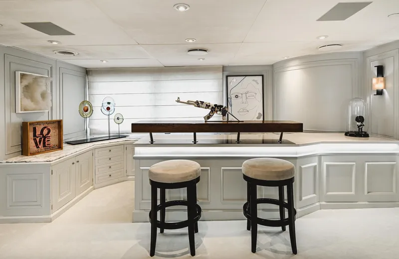 Chakra Yacht Photos Pics Luxurious yacht interior with modern art, bar stools, and elegant decor, Devonport 86m, 1963.