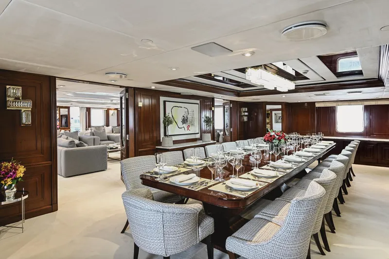 Chakra Yacht Photos Pics Luxurious dining room on Devonport 86m yacht, featuring elegant table setting and plush seating.