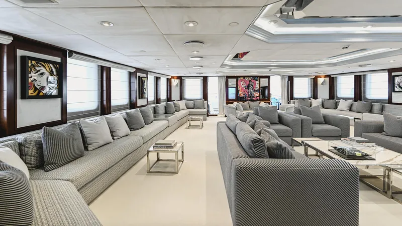 Chakra Yacht Photos Pics Luxurious yacht interior with modern sofas, art, and elegant decor, Devonport 86m, 1963 model.