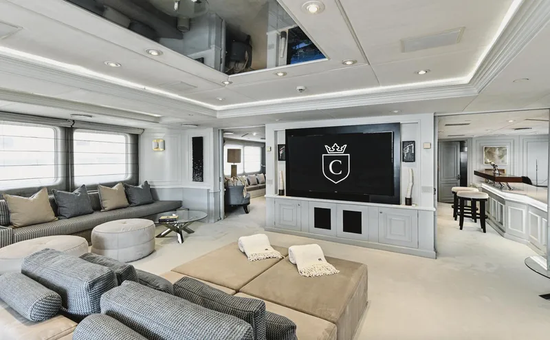 Chakra Yacht Photos Pics Luxurious yacht interior with modern decor, large TV, and comfortable seating, Devonport 86m, 1963 model.