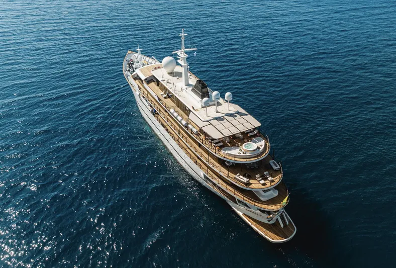 Chakra Yacht Photos Pics Aerial view of 1963 Devonport 86m luxury yacht cruising on open sea.