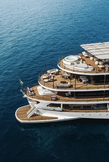 Chakra Yacht Photos Pics Luxurious Devonport 86m yacht from 1963 with multiple decks and a jacuzzi, cruising on blue ocean.