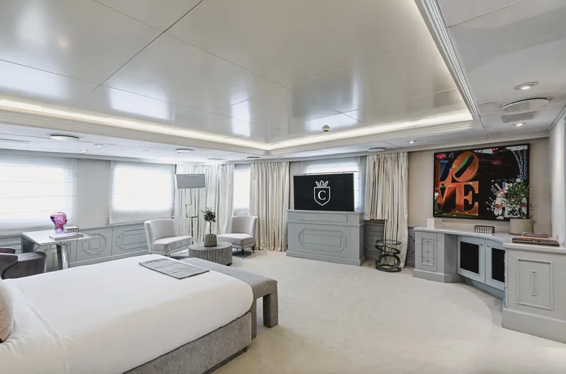 Chakra Yacht Photos Pics Luxurious yacht interior with modern decor, featuring a spacious bedroom and elegant furnishings.