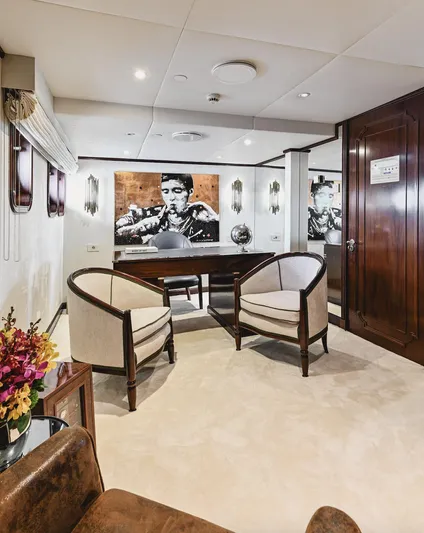 Chakra Yacht Photos Pics Luxurious yacht interior with elegant seating, artwork, and wooden accents, Devonport 86m, 1963.