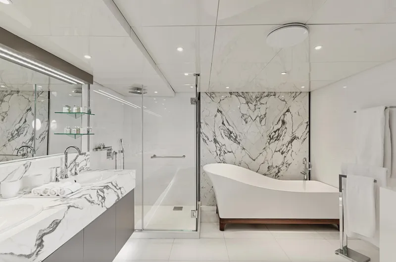 Chakra Yacht Photos Pics Luxurious yacht bathroom with marble accents, freestanding tub, and modern fixtures, Devonport 86m, 1963.