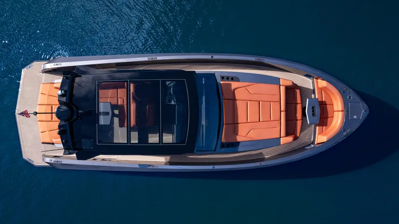 Pharmasea Yacht Photos Pics 2022 Vanquish Yachts VQ45 luxury yacht with sleek design and orange seating, aerial view.