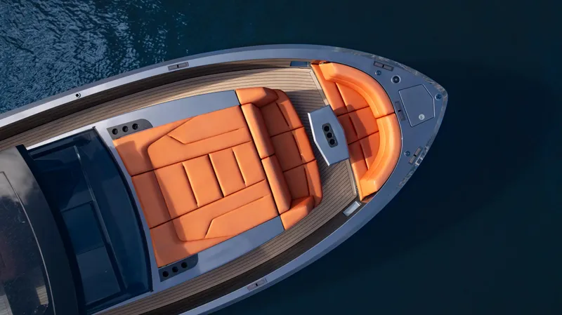 Pharmasea Yacht Photos Pics 2022 Vanquish Yachts VQ45 with orange seating, top view on water.