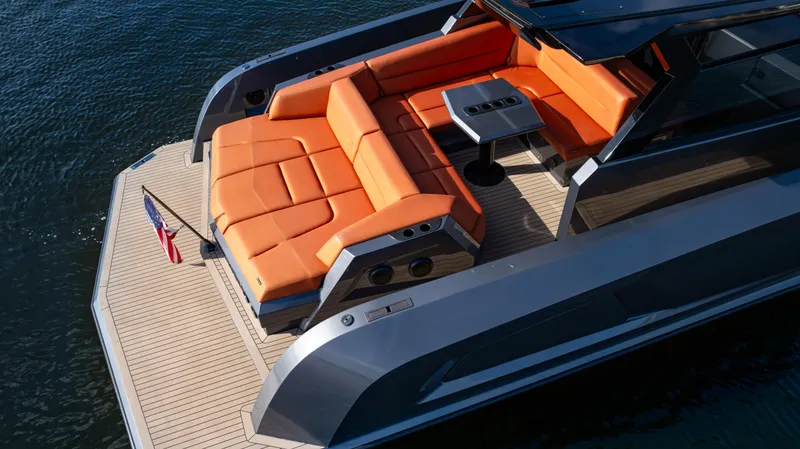Pharmasea Yacht Photos Pics 2022 Vanquish Yachts VQ45 with orange seating, sleek design, and modern deck layout.