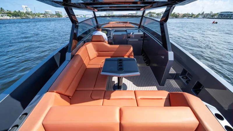 Pharmasea Yacht Photos Pics 2022 Vanquish Yachts VQ45 with orange seating, cruising on open water.
