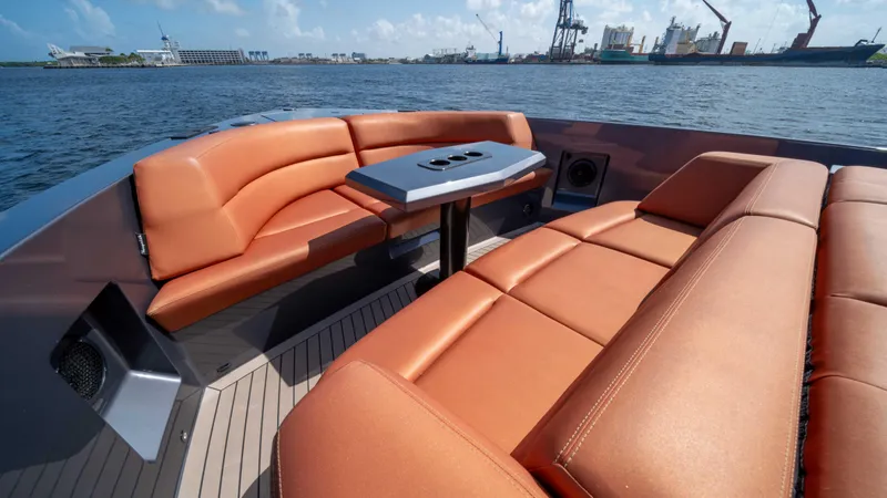 Pharmasea Yacht Photos Pics Luxurious 2022 Vanquish Yachts VQ45 with elegant seating and scenic waterfront view.