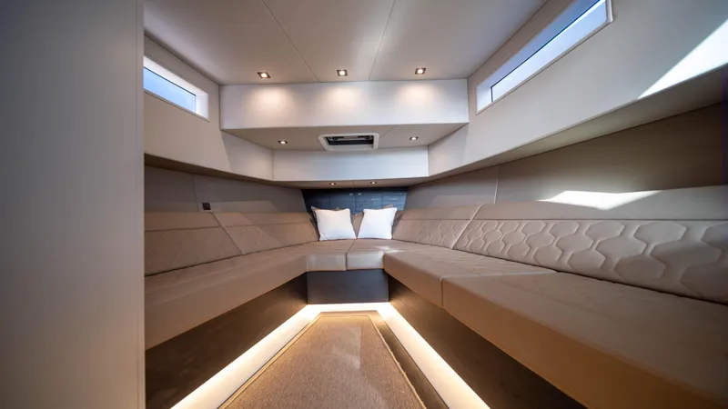 Pharmasea Yacht Photos Pics Luxurious interior of 2022 Vanquish Yachts VQ45 with modern seating and ambient lighting.