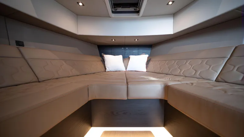 Pharmasea Yacht Photos Pics Luxurious interior of 2022 Vanquish Yachts VQ45 with plush seating and modern design.