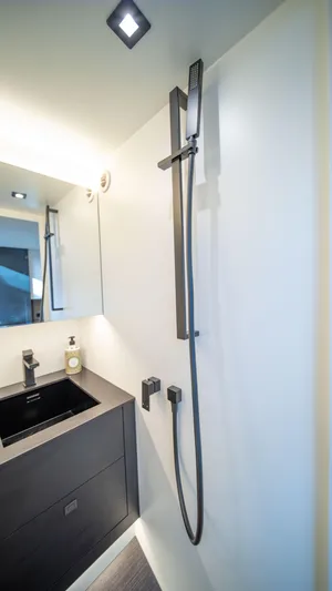 Pharmasea Yacht Photos Pics Modern bathroom in 2022 Vanquish Yachts VQ45 with sleek fixtures and minimalist design.