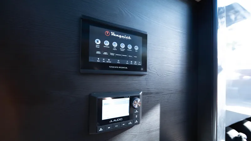 Pharmasea Yacht Photos Pics Control panels on 2022 Vanquish Yachts VQ45, featuring Volvo Penta and JL Audio systems.