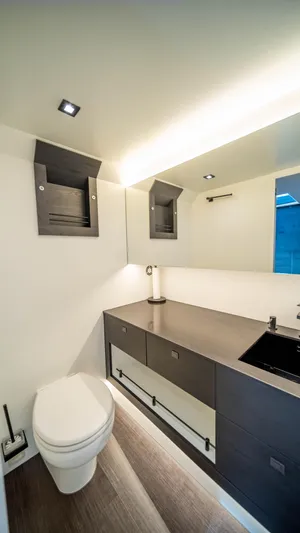 Pharmasea Yacht Photos Pics Modern bathroom interior of 2022 Vanquish Yachts VQ45, featuring sleek design and fixtures.