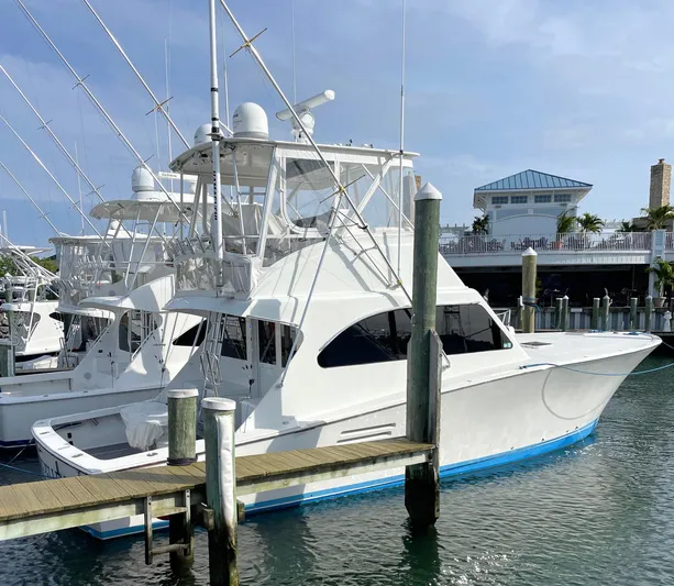 Fish Repellent Yacht Photos Pics 1998 Post 42 Convertible yacht docked at marina under clear sky.