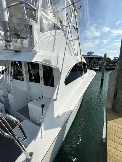 Fish Repellent Yacht Photos Pics 1998 Post 42 Convertible yacht docked at marina under clear sky.