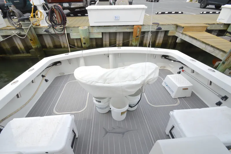 Fish Repellent Yacht Photos Pics 1998 Post 42 Convertible boat deck with fishing gear and dock view.
