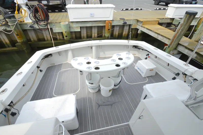 Fish Repellent Yacht Photos Pics 1998 Post 42 Convertible boat deck with fishing setup at dock.