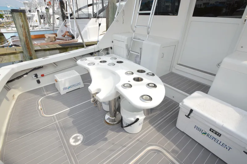 Fish Repellent Yacht Photos Pics 1998 Post 42 Convertible yacht deck with fishing equipment and storage coolers.
