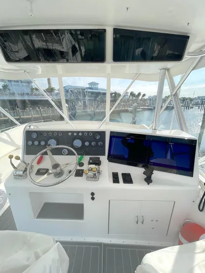 Fish Repellent Yacht Photos Pics 1998 Post 42 Convertible yacht helm with steering wheel and navigation controls.