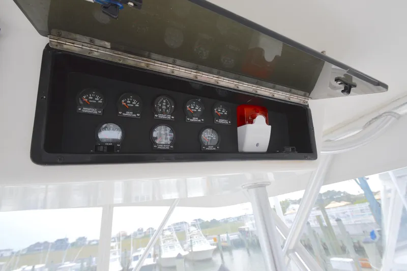 Fish Repellent Yacht Photos Pics Instrument panel on 1998 Post 42 Convertible boat, featuring gauges and alarm system.