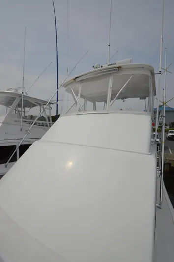 Fish Repellent Yacht Photos Pics 1998 Post 42 Convertible yacht docked, featuring sleek white exterior and fishing rods.