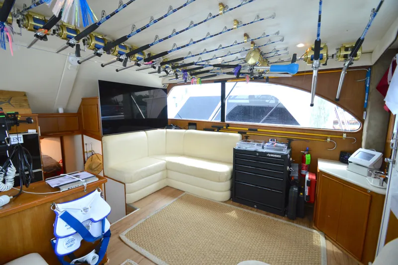 Fish Repellent Yacht Photos Pics Interior of 1998 Post 42 Convertible yacht with fishing rods and cozy seating area.