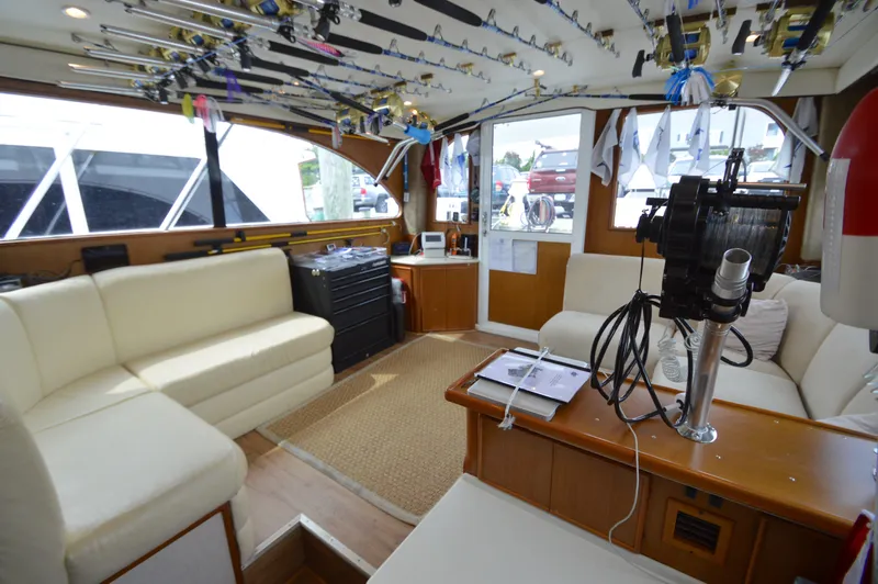 Fish Repellent Yacht Photos Pics Interior of 1998 Post 42 Convertible yacht with fishing rods and cozy seating.