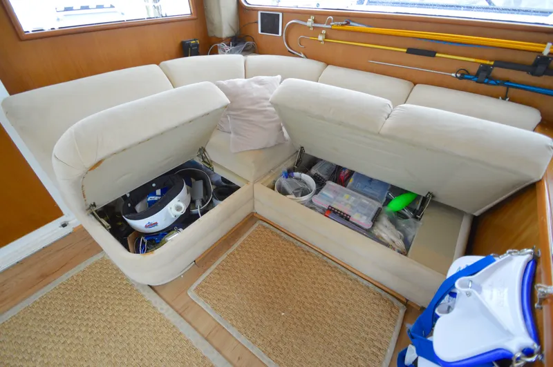 Fish Repellent Yacht Photos Pics 1998 Post 42 Convertible yacht interior with storage under beige seating.