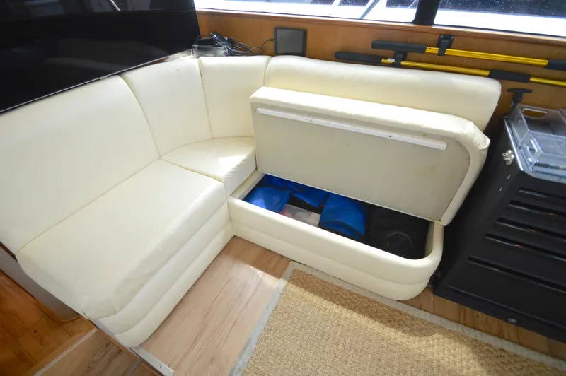Fish Repellent Yacht Photos Pics Cream leather seating with storage compartment open on a 1998 Post 42 Convertible yacht.