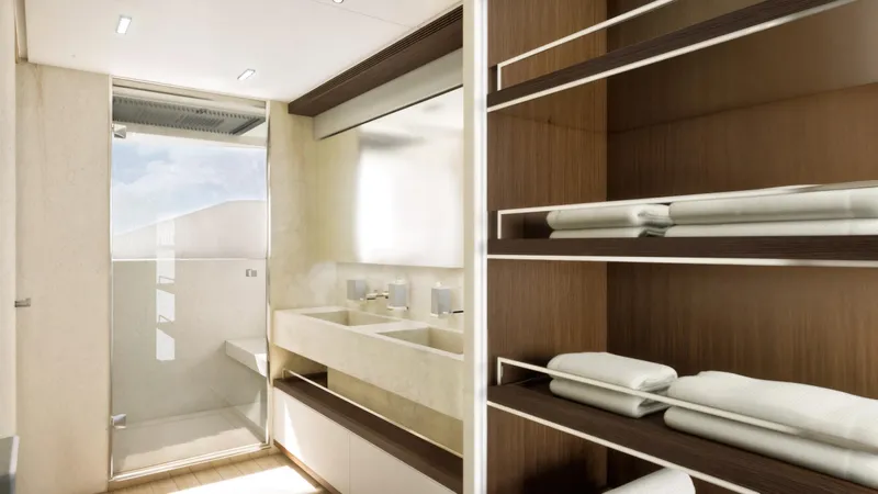  Yacht Photos Pics Luxurious bathroom in 2027 Cantieri di Pisa Custom 40M yacht, featuring modern design and elegant shelving.