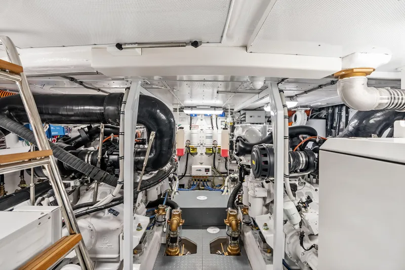  Yacht Photos Pics Engine room of 2026 Neptunus 650F yacht, showcasing advanced machinery and equipment.
