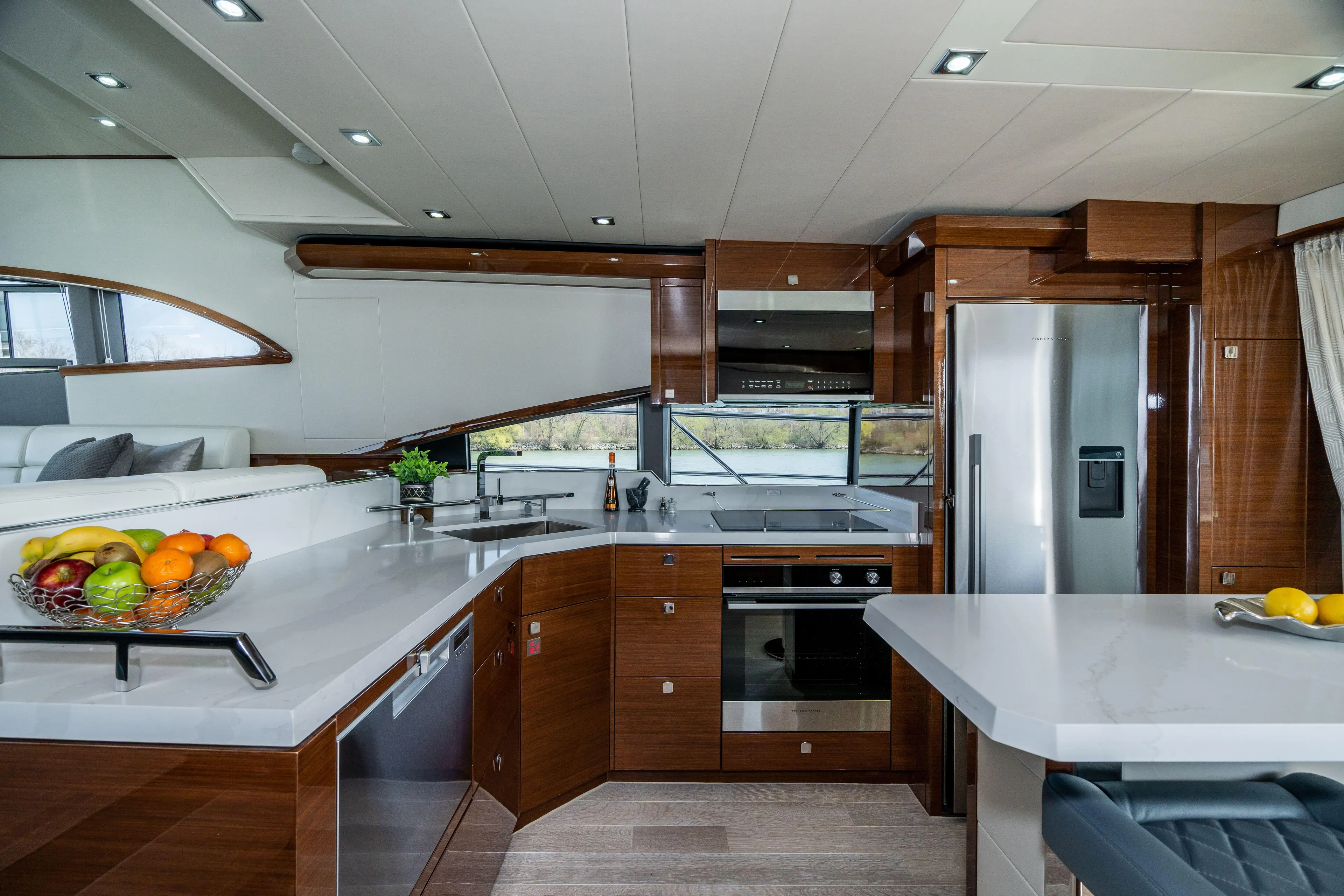  Yacht Photos Pics Luxurious Neptunus 650F yacht kitchen interior, 2026 model, featuring modern appliances and sleek design.