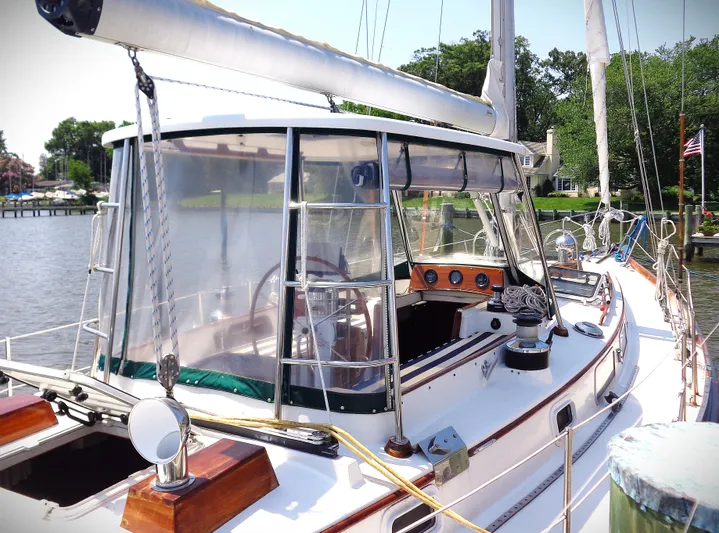  Yacht Photos Pics 1983 Bristol 41.1 sailboat docked, featuring a spacious cockpit and clear canopy.