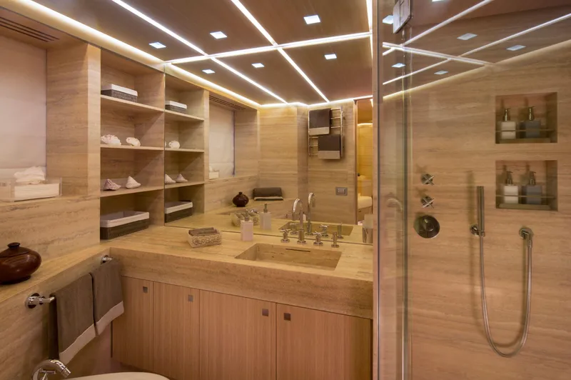Ohana Yacht Photos Pics Luxurious yacht bathroom with wooden finishes, modern fixtures, and glass shower, Fitzroy 49.7m, 2012.