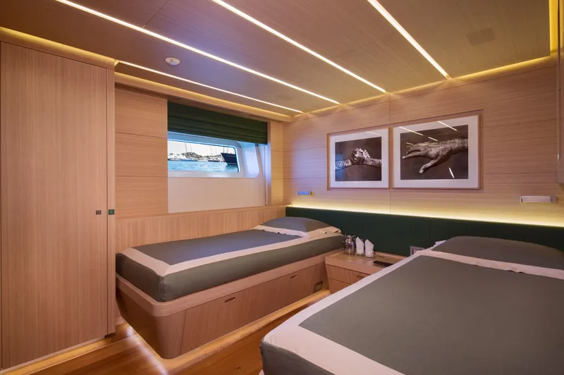 Ohana Yacht Photos Pics Luxurious twin cabin interior on 2012 Fitzroy Yachts 49.7m, featuring modern design and elegant decor.