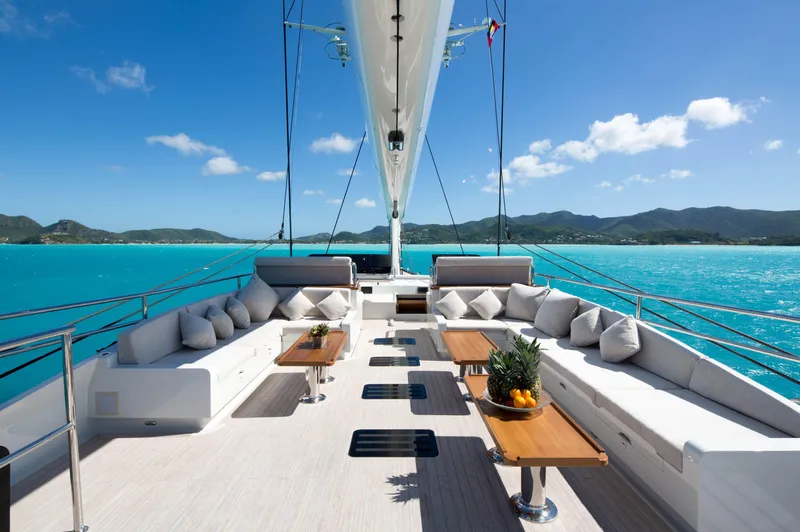 Ohana Yacht Photos Pics Luxurious Fitzroy Yachts 49.7m deck, 2012 model, with elegant seating and ocean view.