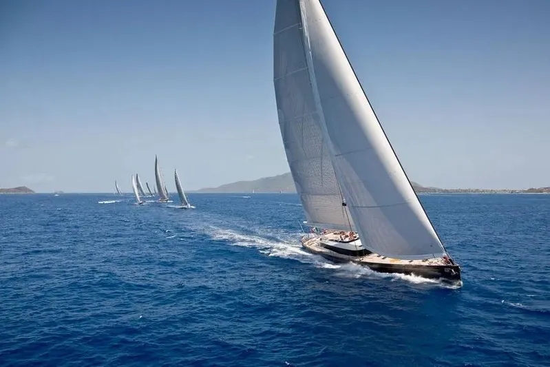 Ohana Yacht Photos Pics Sailing yacht Fitzroy 49.7m, 2012, gliding on open sea with others in the distance.