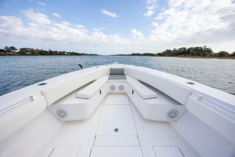  Yacht Photos Pics 2013 Contender 32 Tournament boat interior with spacious seating and scenic water view.