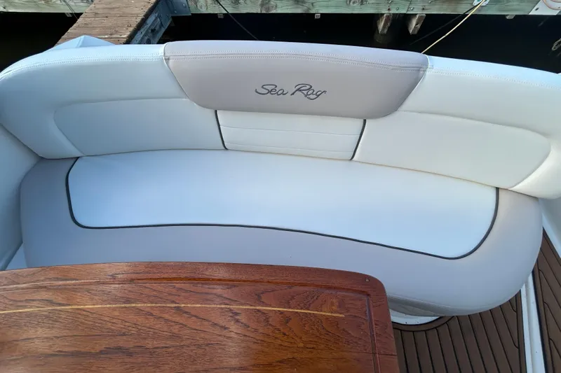  Yacht Photos Pics Luxurious seating on 2010 Sea Ray Sundancer 330 yacht with wooden table.