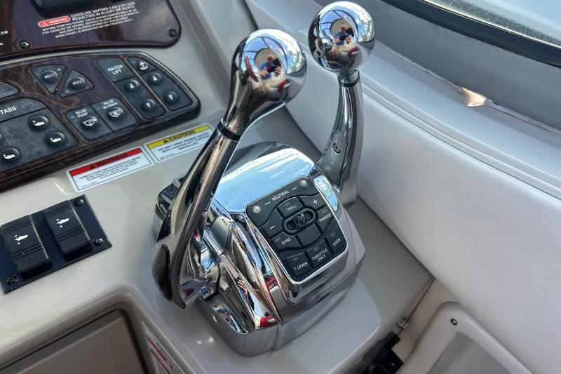  Yacht Photos Pics Control panel of a 2010 Sea Ray Sundancer 330 boat with dual throttle levers.