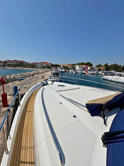  Yacht Photos Pics Luxury Princess 21M yacht docked at marina, clear blue sky, 2007 model.